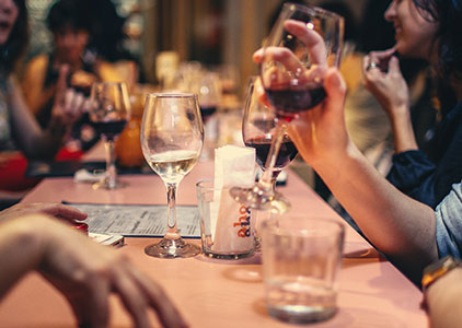 busy restaurant with people drinking wine